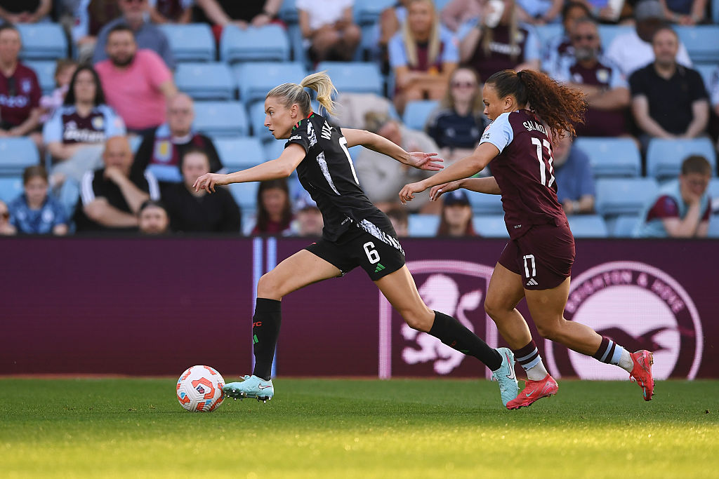 Leah Williamson runs away from Ebony Salmon