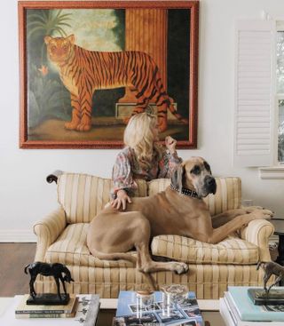 Cornelia Guest pictured in her home alongside pet dog