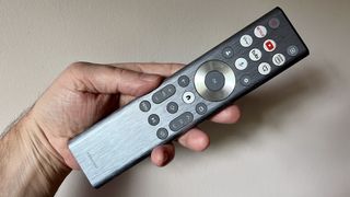 Hisense U8N remote control held in hand