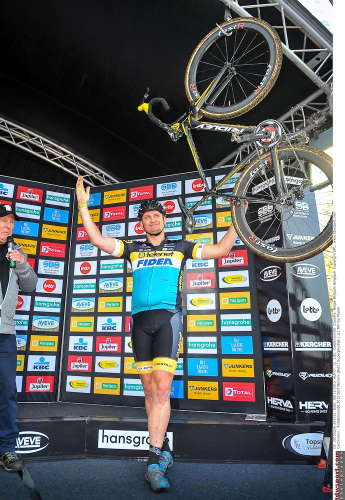 Bart Wellens hangs up his bike on the Ruddervoorde podium