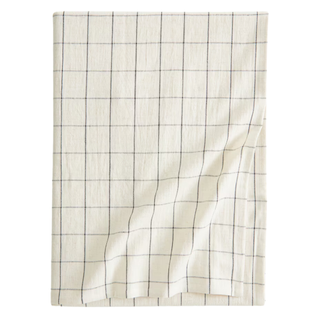 A cotton-blend tablecloth from H&M with a light beige checked pattern