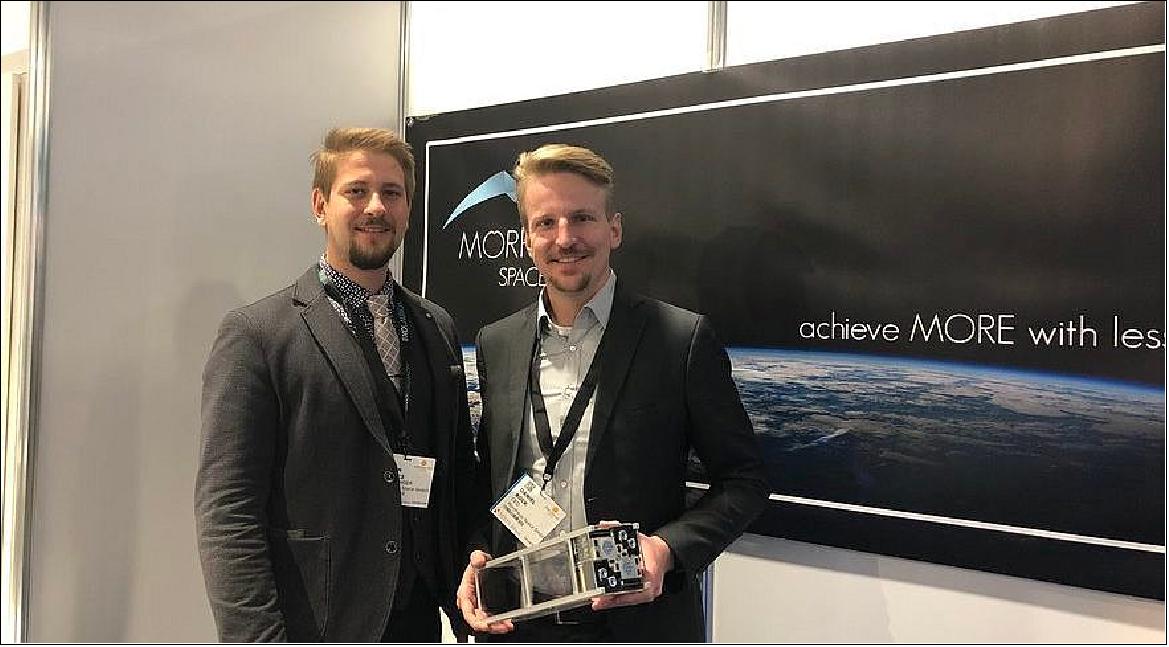 Morpheus Space co-founders pose with a cubesat and thrusters.