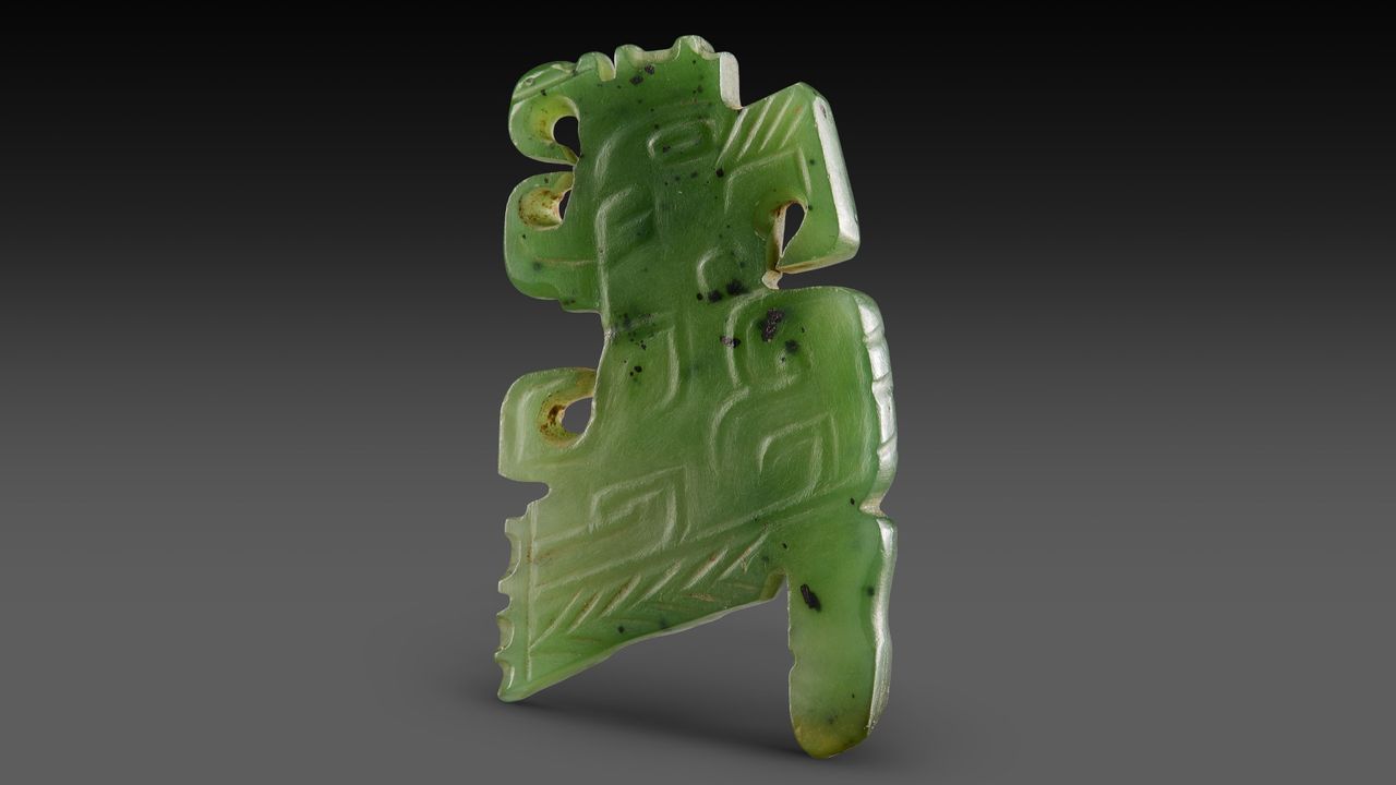 The Zhaigou site includes several elite tombs with wealthy grave goods, like this jade carving of a bird. Archaeologists think it may have been the capital of a state assimilated by the Shang.