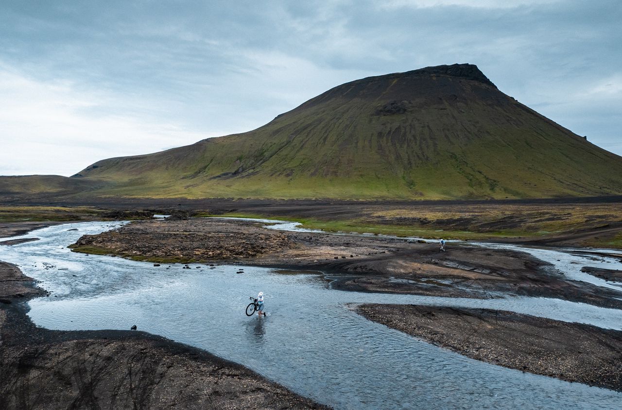 Riders negotiate many water crossings at The Rift across volcanic terrain