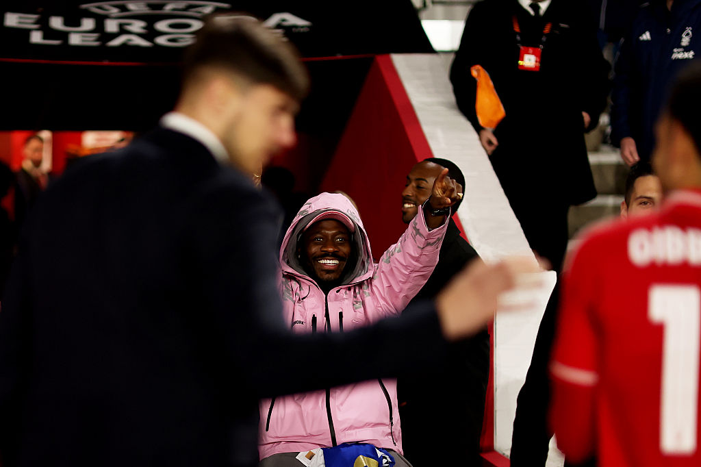 Nottingham Forest's Ola Aina celebrates his side's victory over Porto from the bench