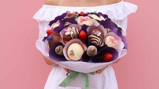 Edible Blooms strawberries and donut bouquet