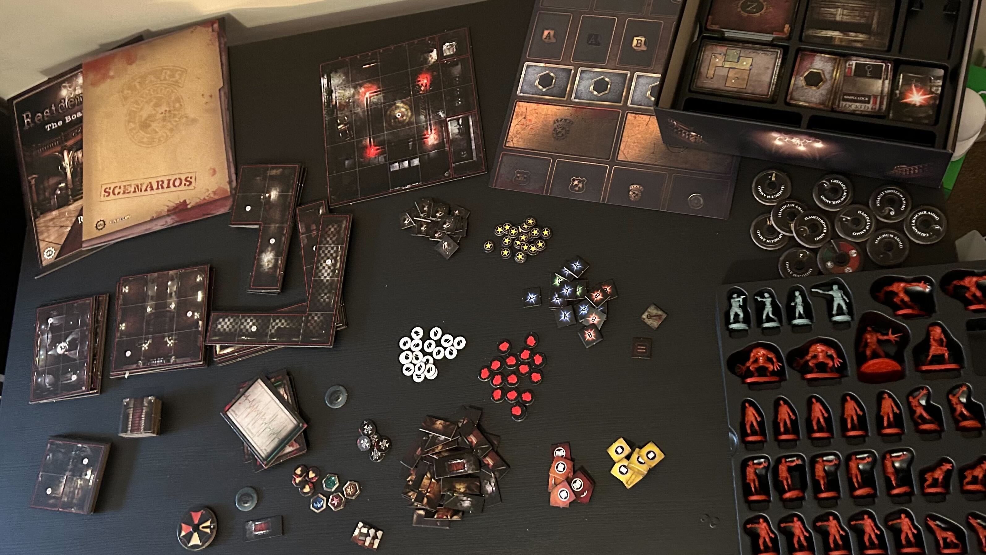 Resident Evil The Board Game pieces on a black table