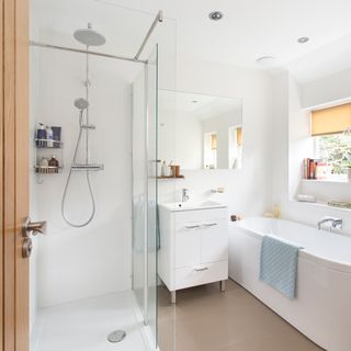 bathroom with white bathtub and drawer and shower area