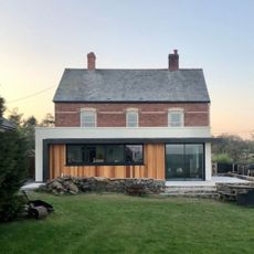 Kitchen extension on a house with lawn