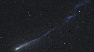A close-up photo of Comet Lemmon's long twisted tail with several clear breaks in the structure