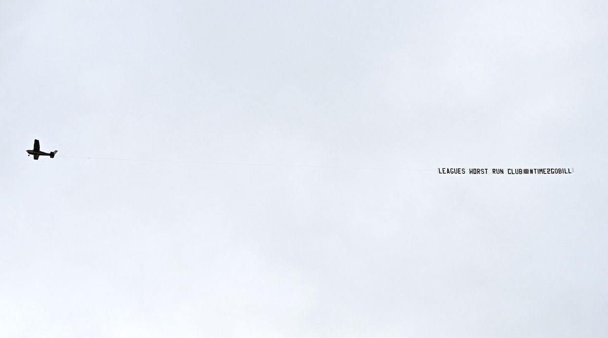 A plane trailing a banner protesting against Everton&#039;s owners flies over Goodison Park during the Premier League match between Everton and Arsenal on 4 February, 2023 in Liverpool, United Kingdom.