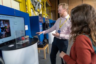 A man and a woman in BT's robotics test lab