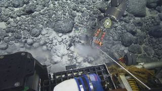A remotely operated vehicle (ROV) collecting the megalodon tooth from a seamount.