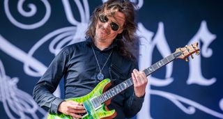 Mikael Åkerfeldt of Opeth takes a solo on his green PRS Custom 24 onstage at Tons of Rock 2024.