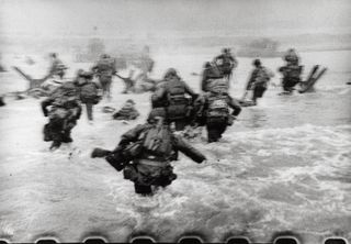 American soldiers landing on Omaha Beach, D-Day, Normandy, France. June 6, 1944. Robert Capa International Center of Photography/Magnum Photos
