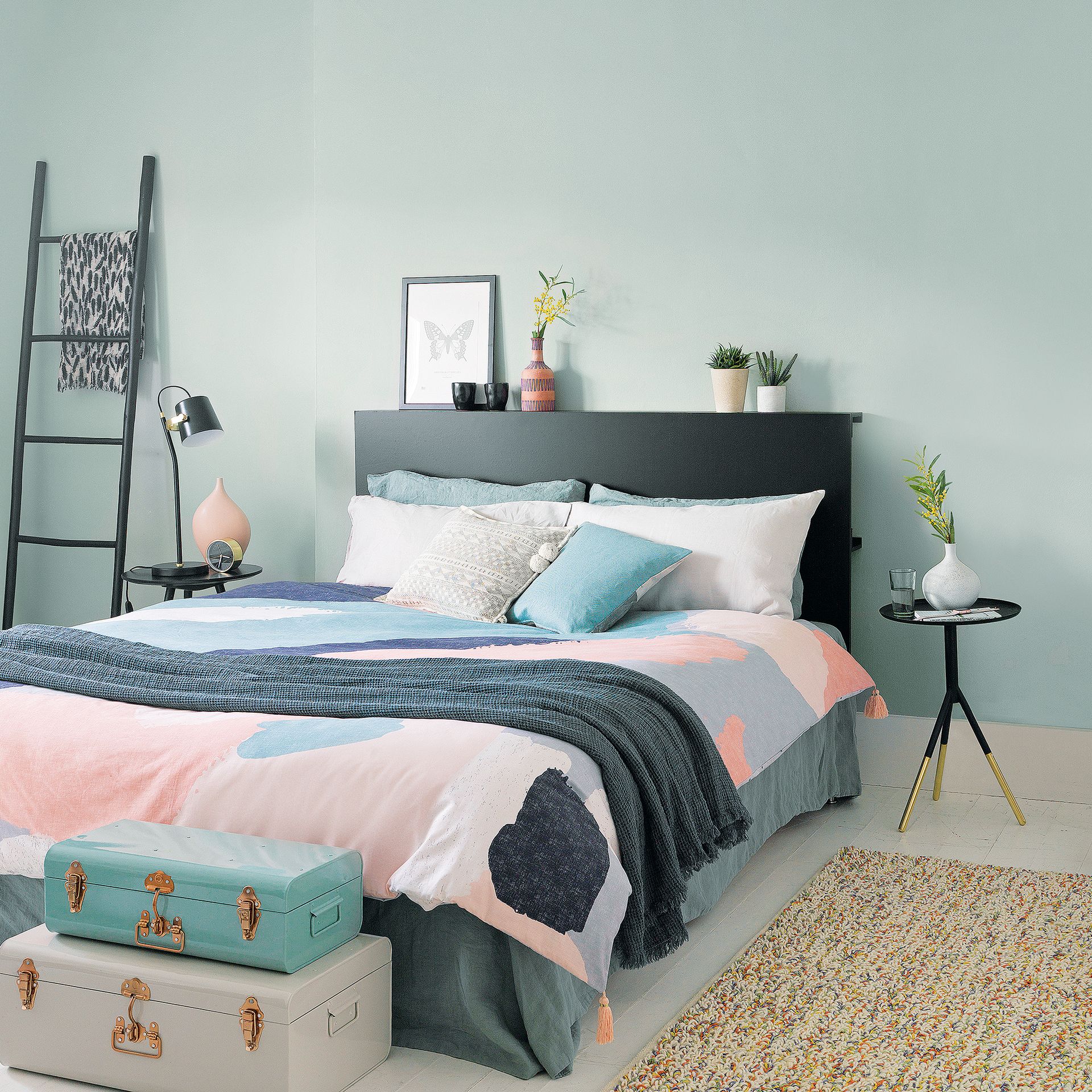 Blue bedroom with pink patterned bed