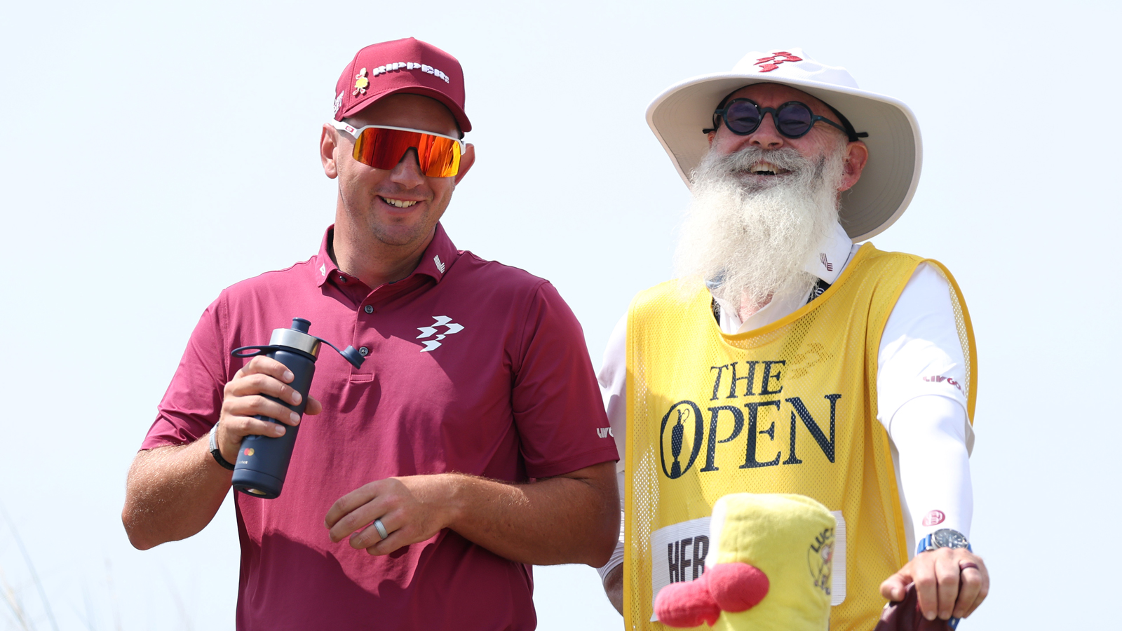 Lucas Herbert talks to his caddie