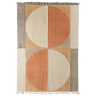 large orange rug with circle geometric pattern