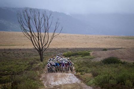 The lead bunch leaves Caledon during stage 5 of the 2012 Absa Cape Epic Mountain Bike stage race from the Overberg Primary & High School in Caledon to Oak Valley Wine Estate in the Elgin Valley, South Africa on the 30 March 2012