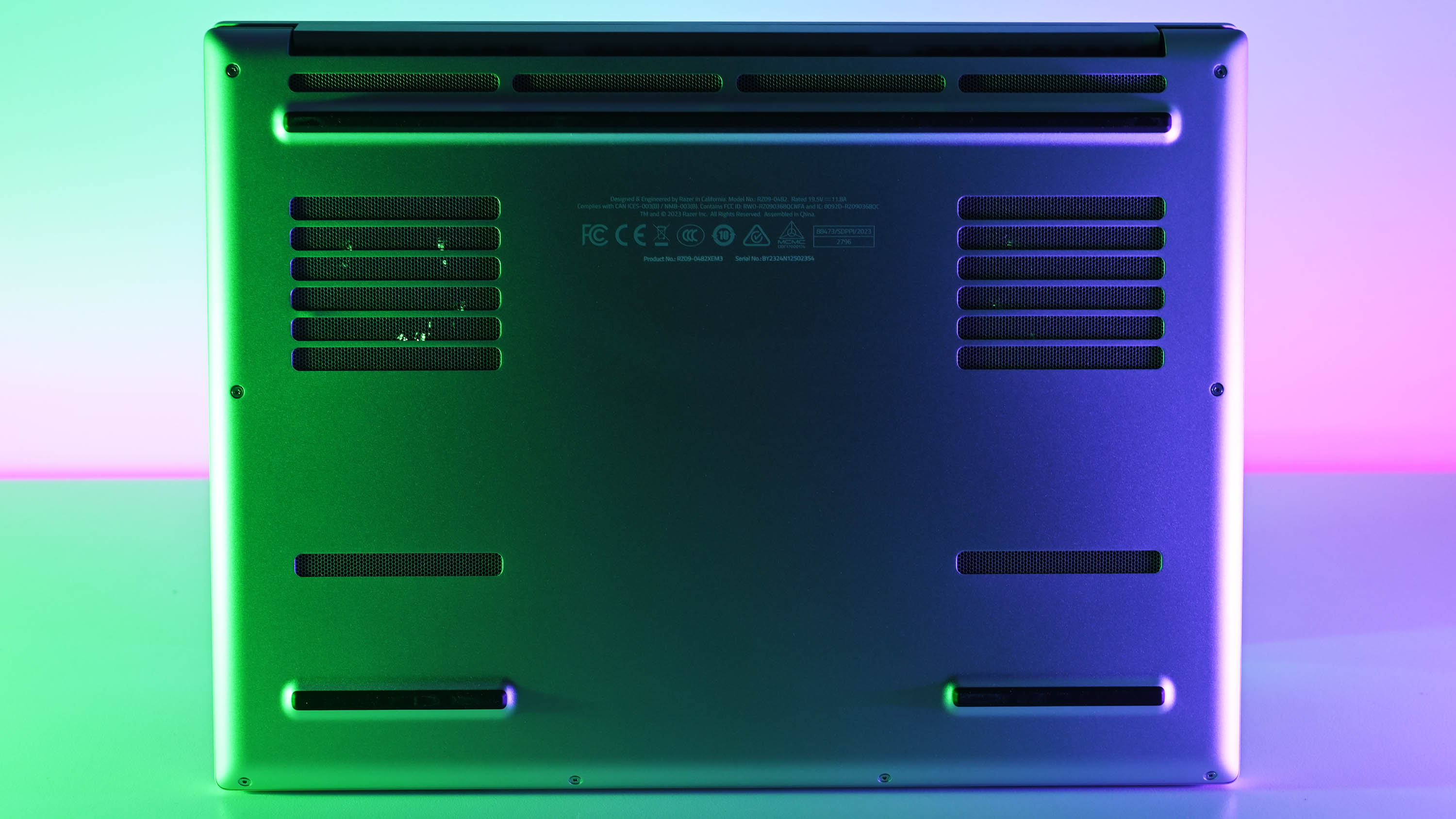 Razer Blade 14 Mercury Edition underside showing cooling vents and rubber feet