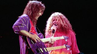 Sammy Hagar and Eddie Van Halen perform together in 1991