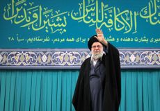 Iran's Supreme Leader Ayatollah Ali Khamenei greets the crowd