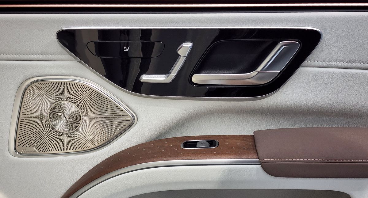 Inside passenger door panel showing seat and window controls