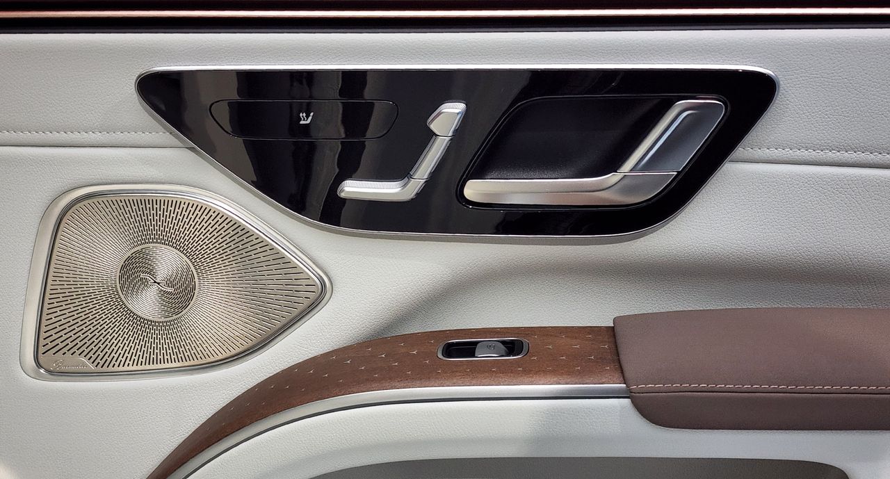 Inside passenger door panel showing seat and window controls