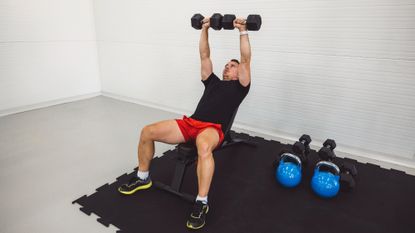 Man doing dumbbell incline presses