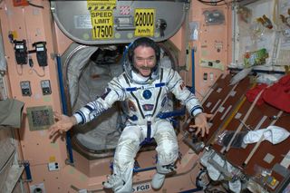 Canadian astronaut Chris Hadfield, Expedition 35 commander, poses in his Russian Sokol spacesuit while preparing for a May 13, 2013 landing on a Soyuz spacecraft.