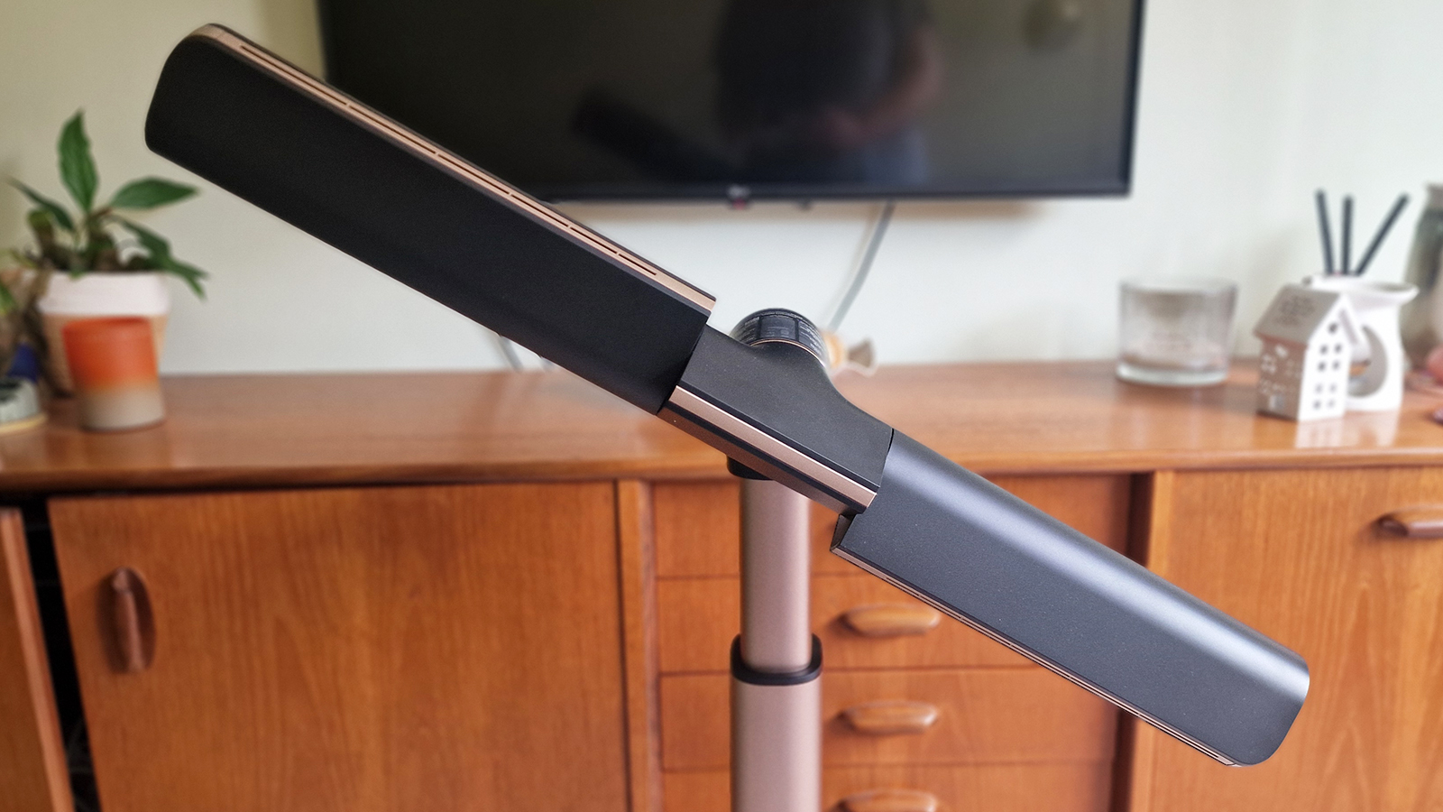 Shark TurboBlade in a living room in front of a walnut console