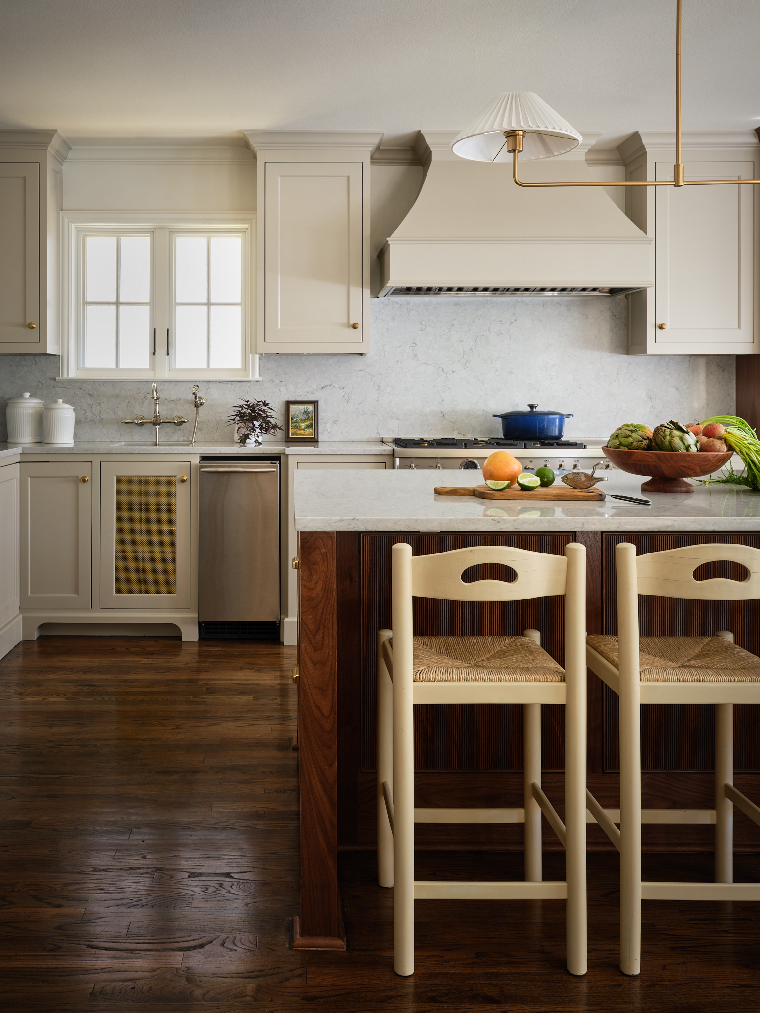 neutral kitchen with rich wood flooring