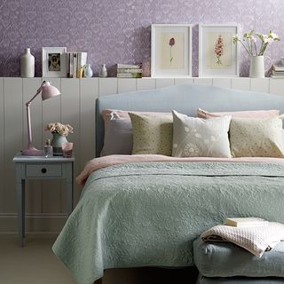 bedroom with bed and lamp on table