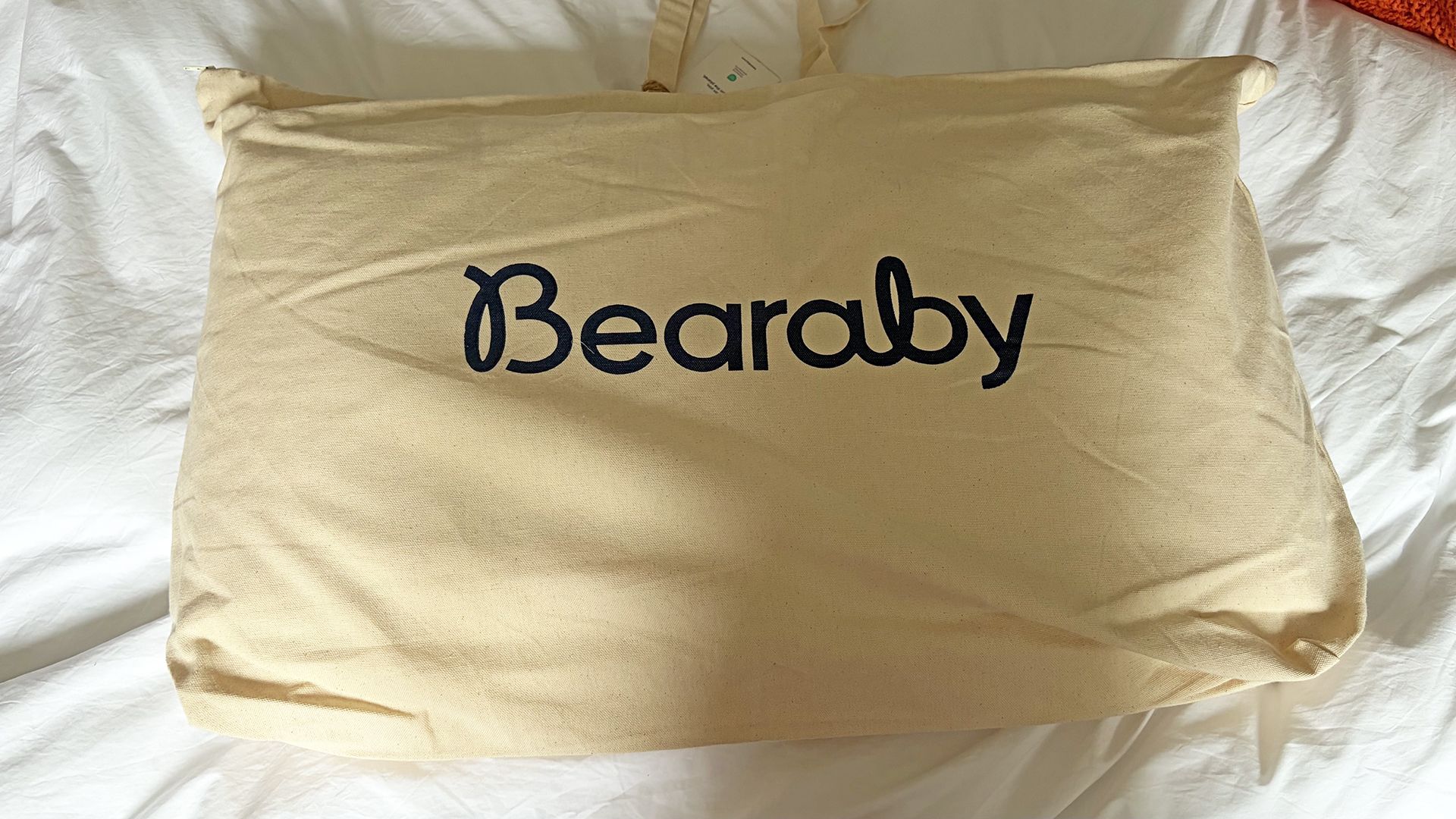 A large bag with the word Bearaby printed on the front