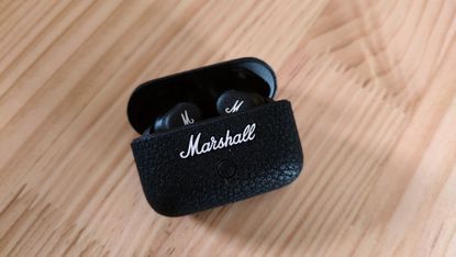 Marshall Motif II ANC review: earphones and the case on a table