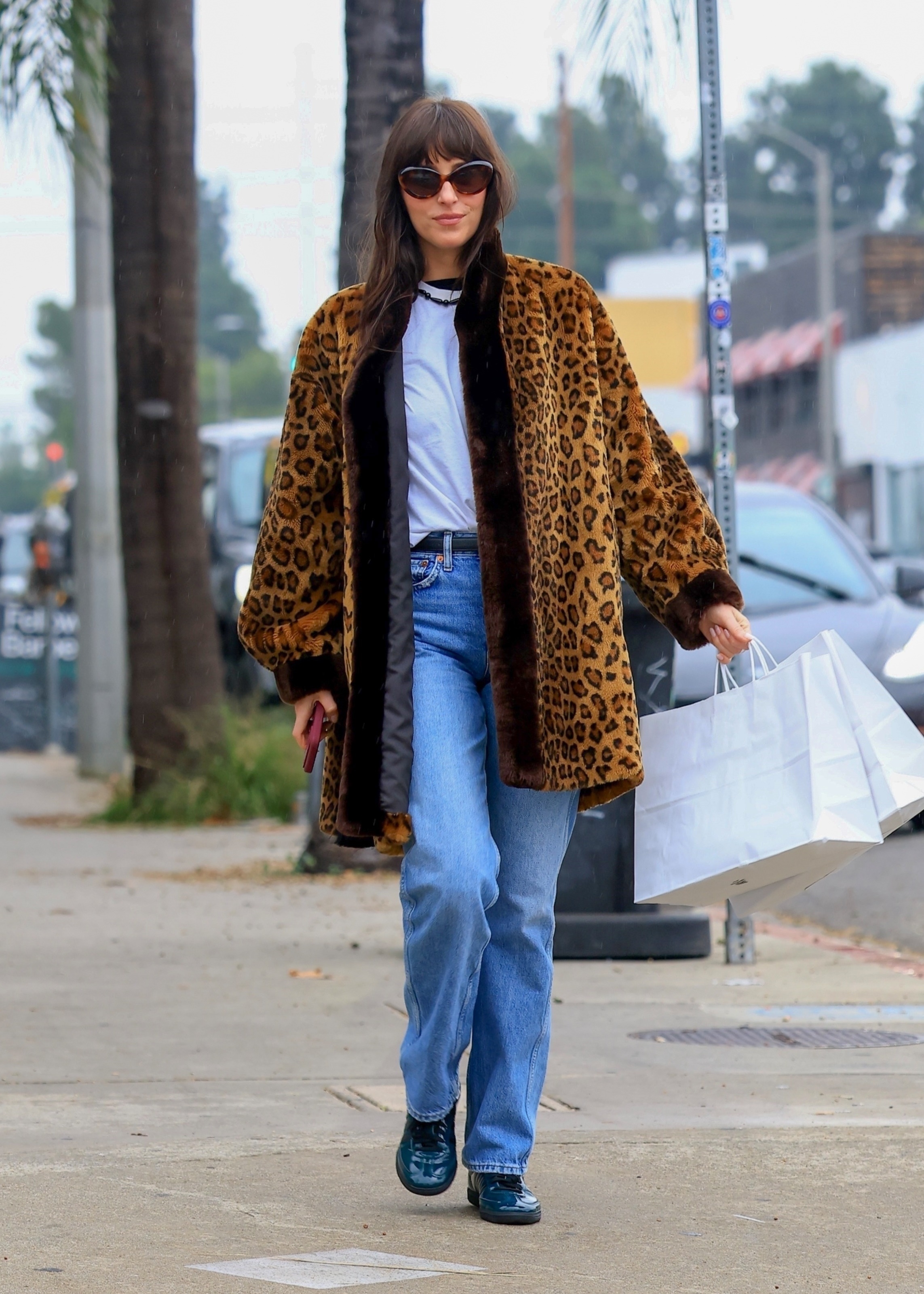 Dakota Johnson and her mother, Melanie Griffith, were spotted doing last-minute Christmas shopping at Scout Women's Clothing before heading off in separate cars. The low-key outing showed coordinated denim looks and relaxed vibes as the duo wrapped up holiday errands around the city.