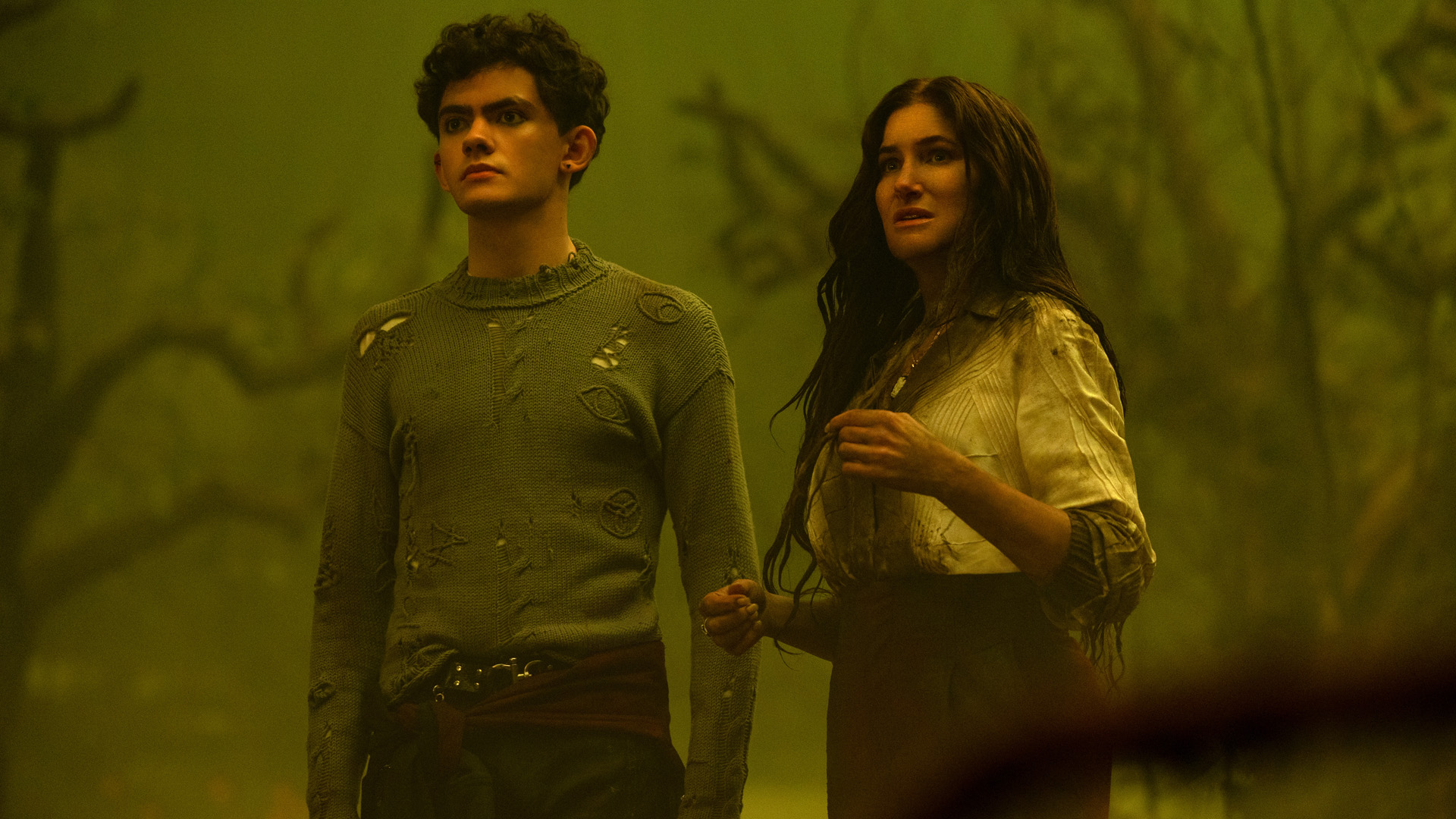 Teen and Agatha stand on The Witches' Road as it is bathed in a dirty yellow light in Agatha All Along