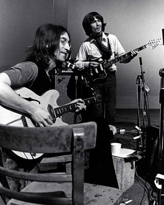 John Lennon and George Harrison in the studio