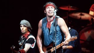 Nils LOFGREN and Bruce SPRINGSTEEN, with Nils Lofgren behind, performing live onstage on Born In The USA tour, January 1985
