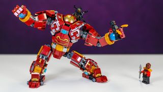 Lego Marvel Hulkbuster being attacked by an Outrider, while holding another in its left hand. 