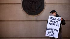 ALEXANDRIA, VIRGINIA - NOVEMBER 13: A protester holds a sign outside the Albert V. Bryan United States Courthouse on November 13, 2025 in Alexandria, Virginia. The court is hearing oral argument challenging the appointment of U.S. Attorney for the Eastern District Lindsey Halligan, who signed the indictments against former FBI Director James Comey and New York Attorney General Letitia James, was illegitimate. (Photo by Alex Wong/Getty Images)