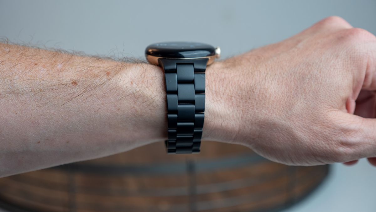 The Google Pixel Watch with the official metal band in matte black