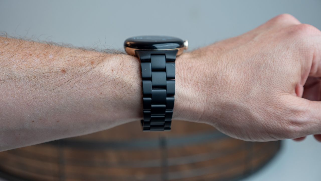 The Google Pixel Watch with the official metal band in matte black