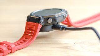 Close up of the Amazfit T-Rex 3 smartwatch on an orange silicone strap