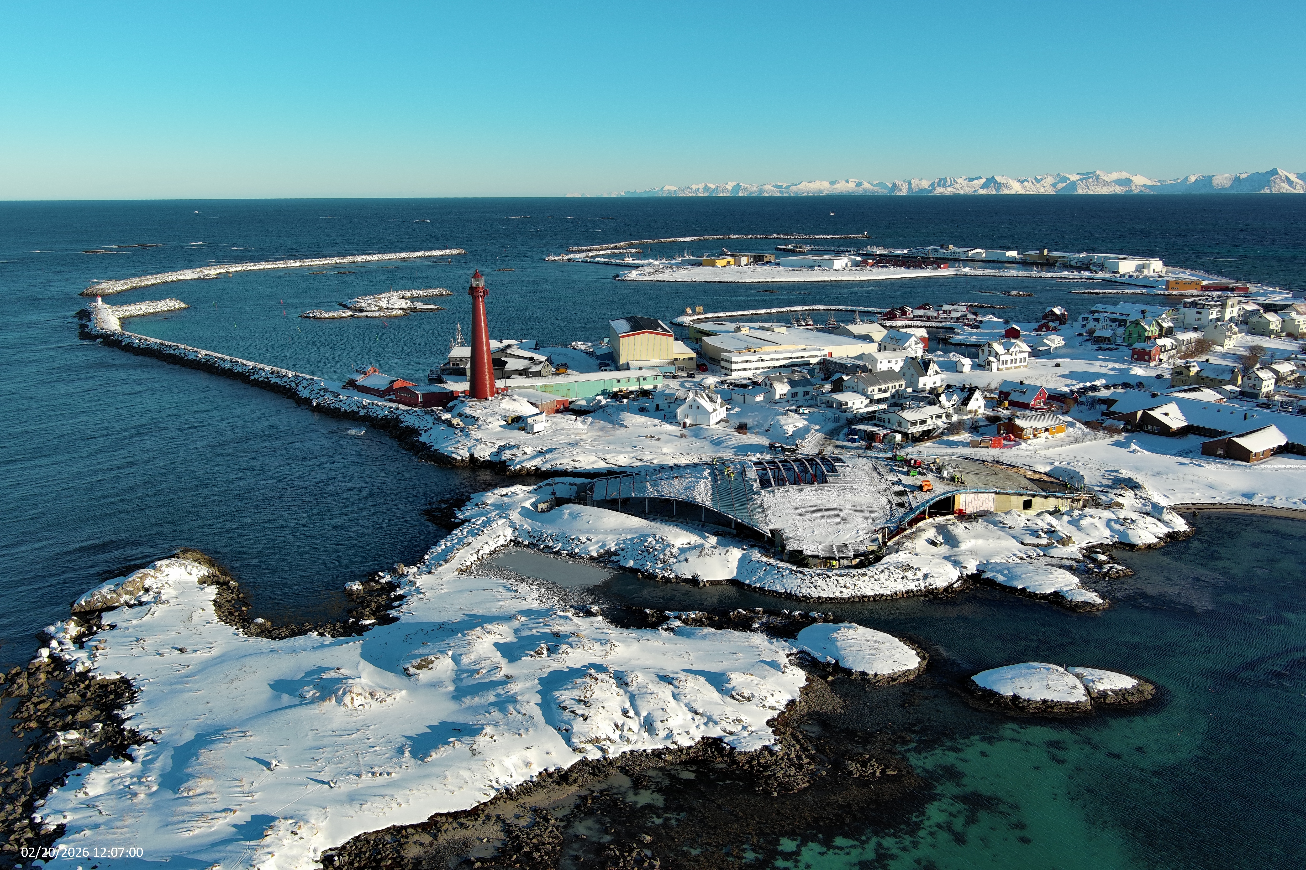 photo of the building site of The Whale by Dorte Mandrup in the Norwegian coast line among snow