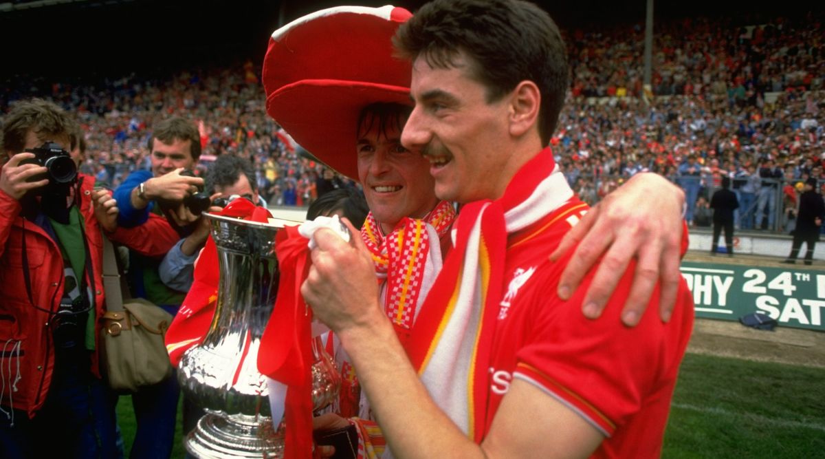 May 1986: Kenny Dalglish (left) and Ian Rush of Liverpool pose with the trophy after the FA Cup final against Everton at Wembley Stadium in England. Liverpool won the match 3-1. \ Mandatory Credit: David Cannon/Allsport