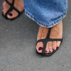 Influencer wearing a summer nail colour on her toes
