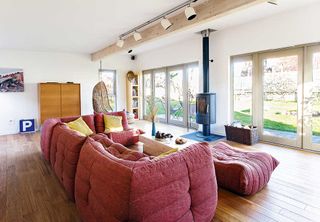 garden studio room living area with woodburner