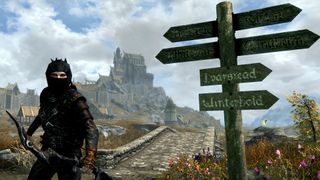 Skyrim character standing at crossroads
