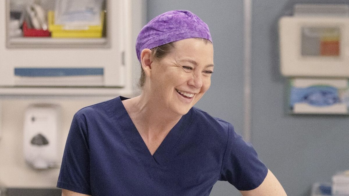 Ellen Pompeo as Meredith Grey laughing on Grey&#039;s Anatomy.